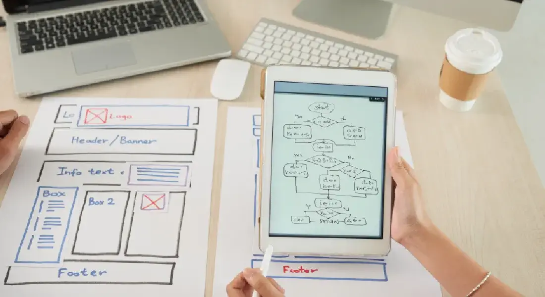 awesome web design blog - hands holding a tablet with interface design elements