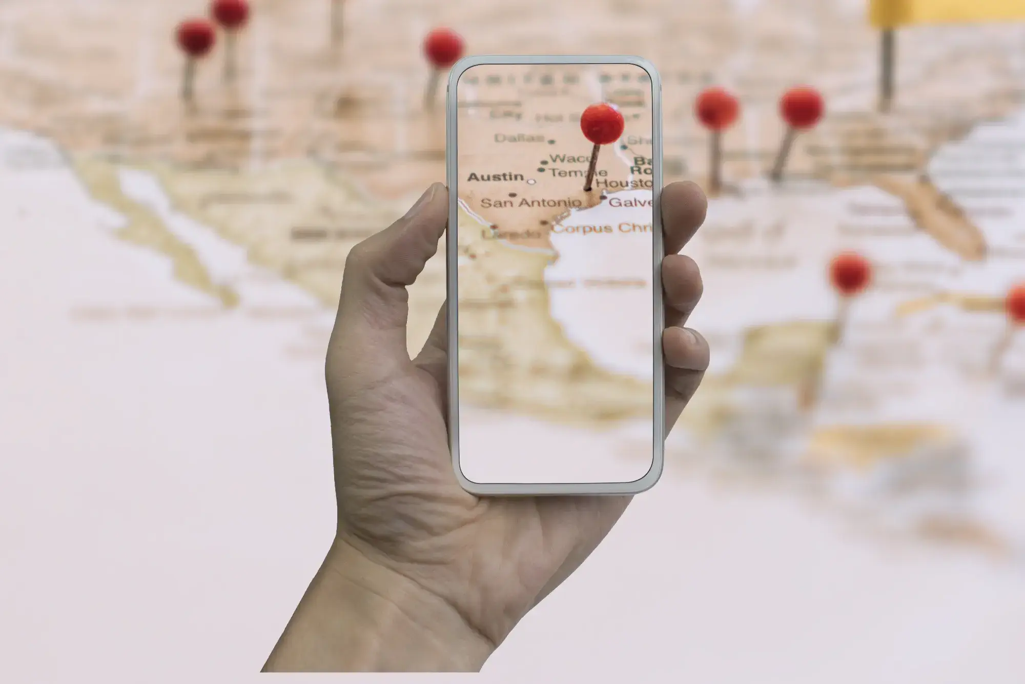 Local SEO - phone in front of map, across us, locations