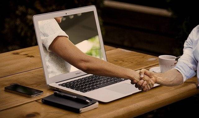 Laptop handshake - EWR Digital